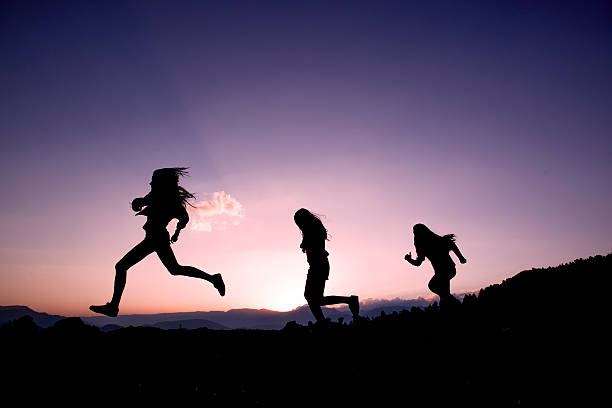 istock Happy Friends Running On Mountains 504343927