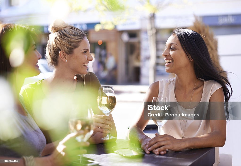 Enjoying a glass of wine with my best friends Cropped shot of three women enjoying a glass of white wine Outdoors Stock Photo