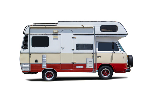 Photo of an antique RV isolated on white.