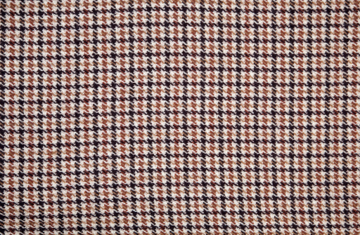 Houndstooth beige and brown fabric.