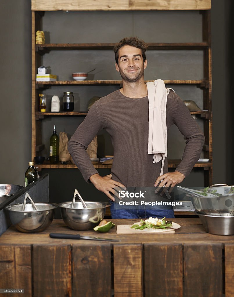 He's proud to be an entrepreneur Portrait of a handsome young man standing at his food stall Cooking Stock Photo