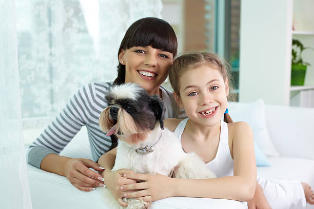 istock Mother, daughter and pet 504368979