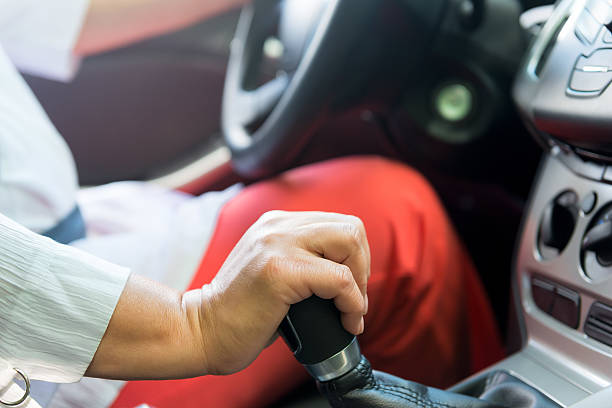 istock woman's hand speed switches in the vehicle while driving 504369496
