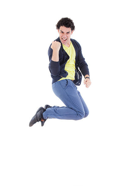 istock Excited successful man jumping of joy with proud expression 504369695