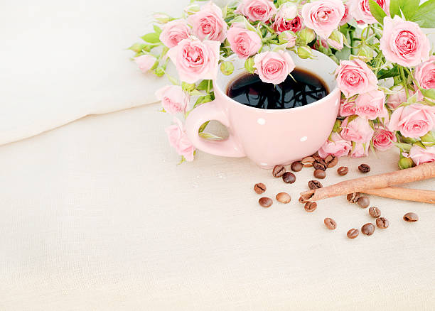 istock Cup of black coffee and red rose. 504369875
