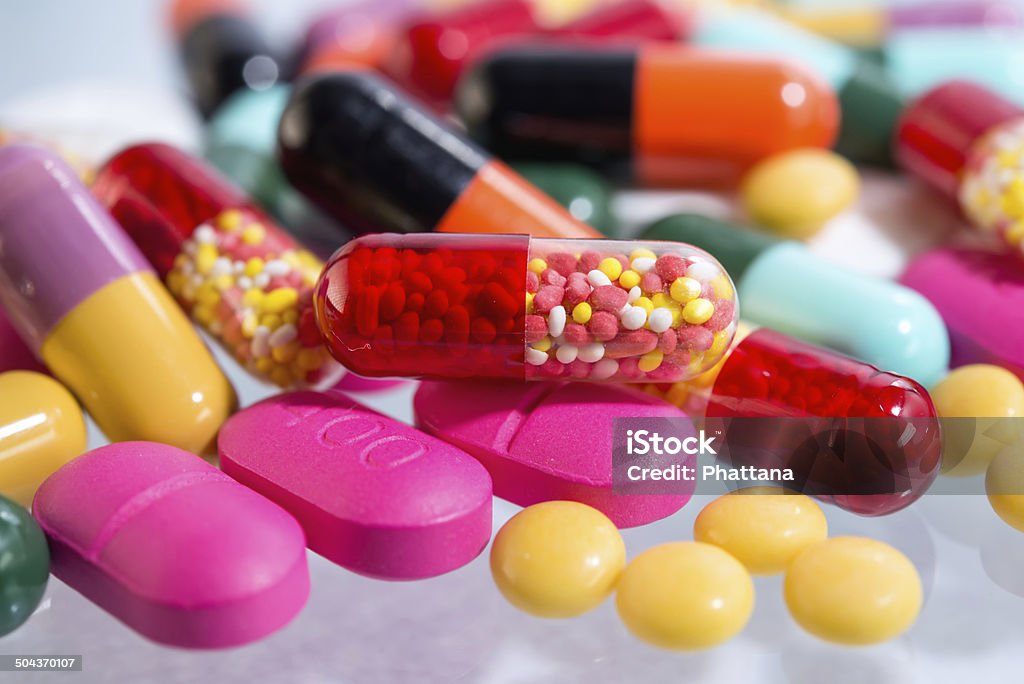 Many colorful pills Addiction Stock Photo