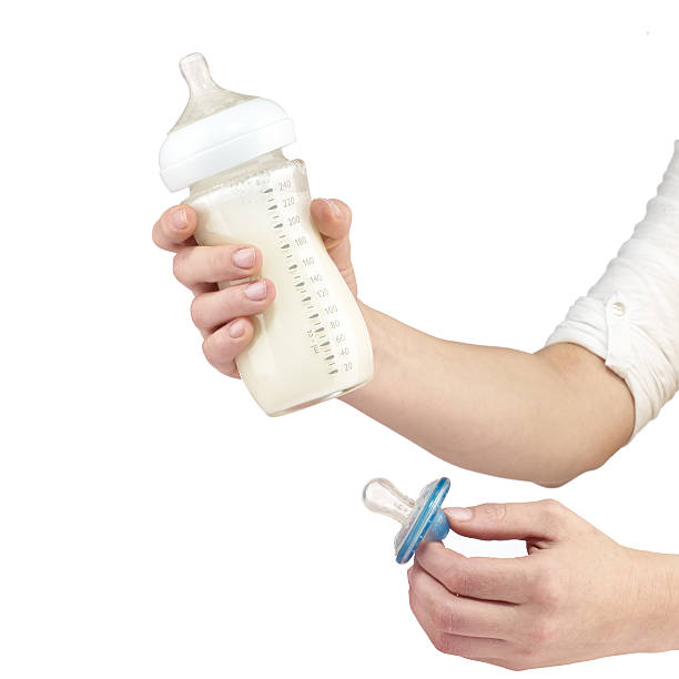 istock Baby bottle with milk. 504370361