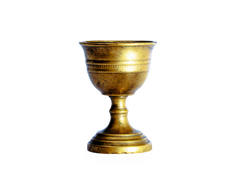 Ancient chalice of copper on white background