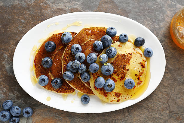 istock hot golden pancakes with berry on plate 504374376