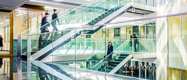 istock Businesspeople walking in office corridor, blurred motion 504374862