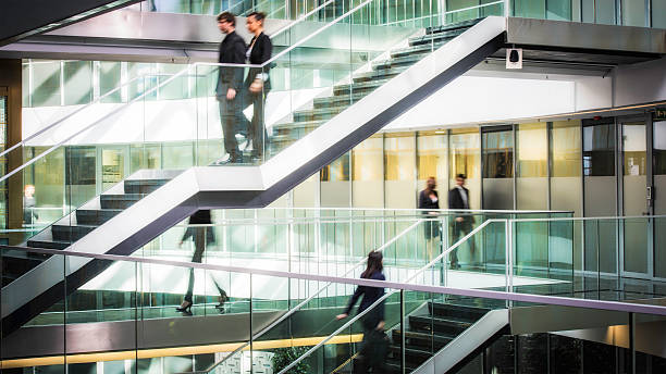 istock Businesspeople walking in office corridor, blurred motion 504375102