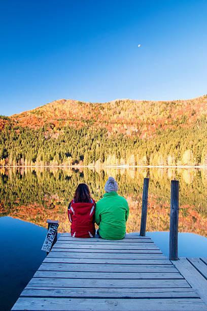 istock Young couple by the lake 2 504375120