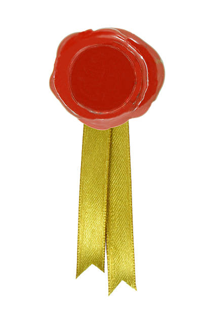 istock Round red wax seal with a golden ribbon 504376786