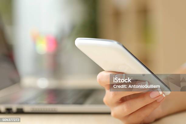 Woman Hand Using A White Smart Phone Stock Photo - Download Image Now - Adult, Business, Business Finance and Industry