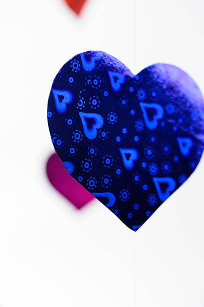 Multicolored paper hearts hanging on the line