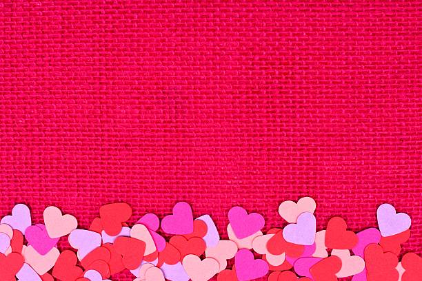 istock Paper Valentines Day hearts bottom border on pink burlap 504382008
