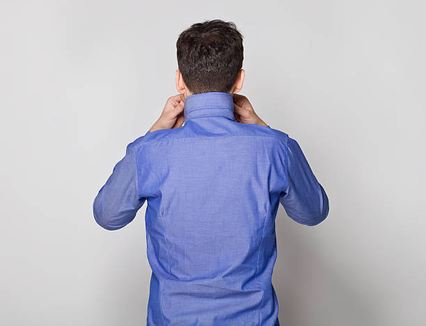 istock Young man back portrait in blue. 504382472