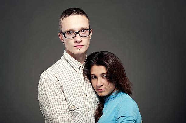 istock Beautiful young couple on a gray background 504382622