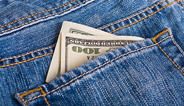 Dollars in the jeans stock photo