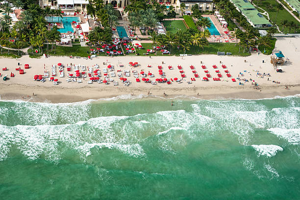 istock crowds sunbathing on the beach in miami 504383418