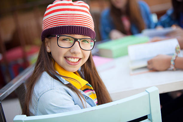 istock Happy student girl wearing glasses 504384408