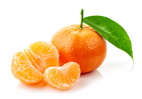fresh ripe tangerines with green leaf isolated on white background