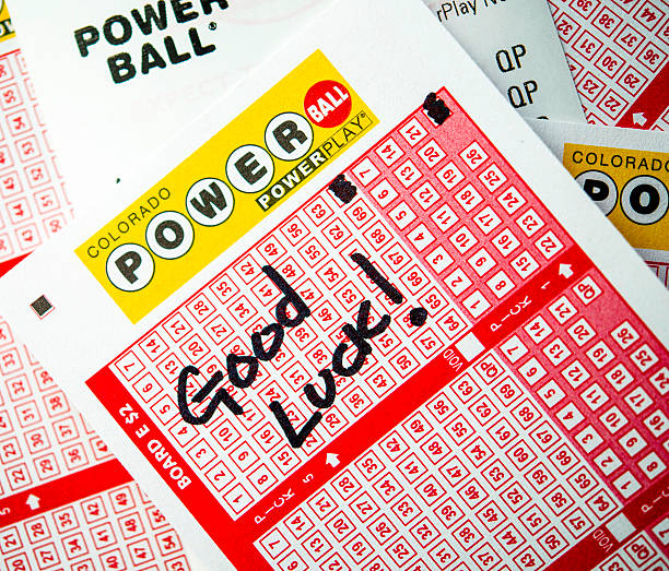 Powerball tickets for the lottery Peyton, Colorado, USA - January 11, 2016: A horizontal format studio shot of a Colorado state entry form for the Powerball Lottery to be held on Wednesday 13 January, 2016. The entry forms have been marked with Quick Pick selections, meaning the numbers are selected at random by the computer at point of sale. On top of the numbers is written, "Good Luck!" Underneath the entry form is the printed ticket with selected numbers for the draw. goldco review article stock pictures, royalty-free photos & images