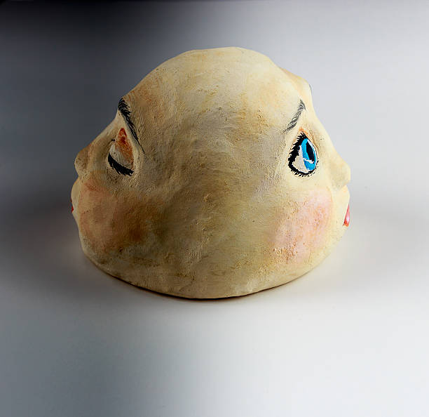 istock Clay Head Sculpture Depicting Opposites 504385340