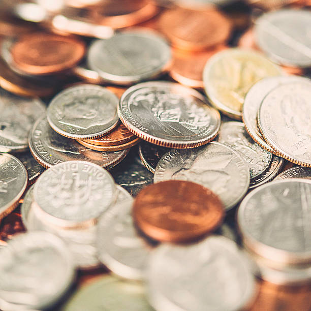 istock American currency coins background 504385388