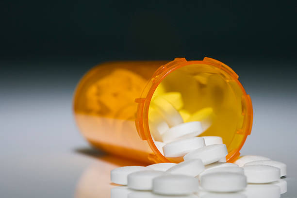 istock Bottle of open prescription pills 504385672
