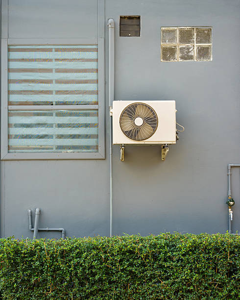 istock Air compressors unit is outside the office building. 504385758