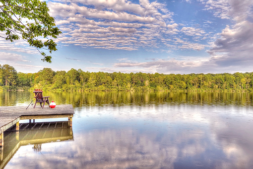 Fishing equipment and chair set up on a lake in Georgia.