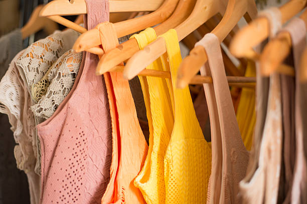 istock Clothing hanging on a bar from a store 504387246
