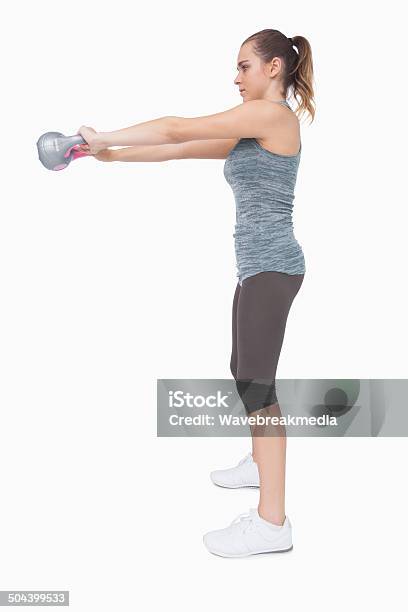 Young Woman Working With A Kettle Bell Stock Photo - Download Image Now - Exercising, Kettlebell, White Background