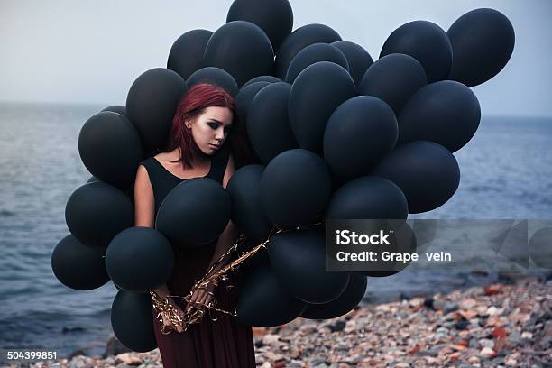 Beautiful Girl Walking With Black Balloons Stock Photo - Download Image Now - Adult, Balloon, Beach