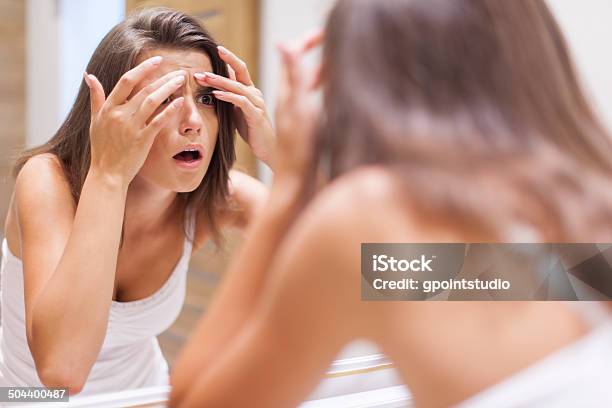Shocked Woman Squeezing Pimple In Bathroom Stock Photo - Download Image Now - Acne, Human Face, Pimple