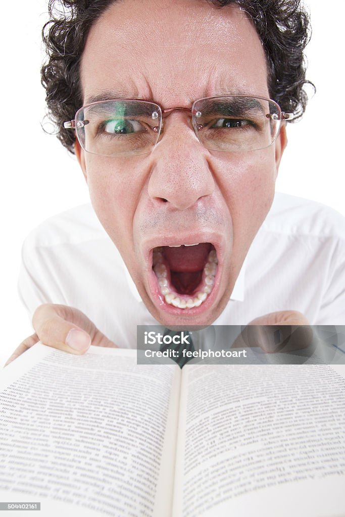 angry nerd in shirt with glasses holding open book close up of angry nerd in shirt and tie with glasses holding open book, funny image Adult Stock Photo