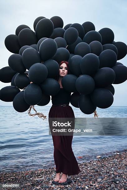 Beautiful Girl Walking With Black Balloons Stock Photo - Download Image Now - Adult, Balloon, Beach