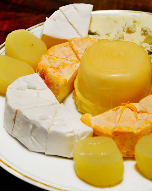 istock White plate with different kinds of cheese 504402341