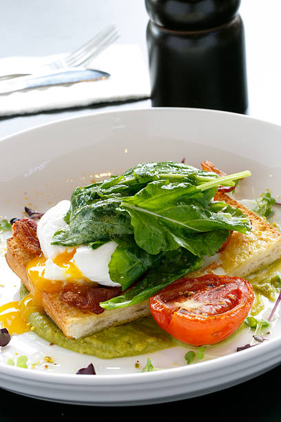 istock Poached Eggs, Wholegrain Bread, Tomato and Vegetables 504402535