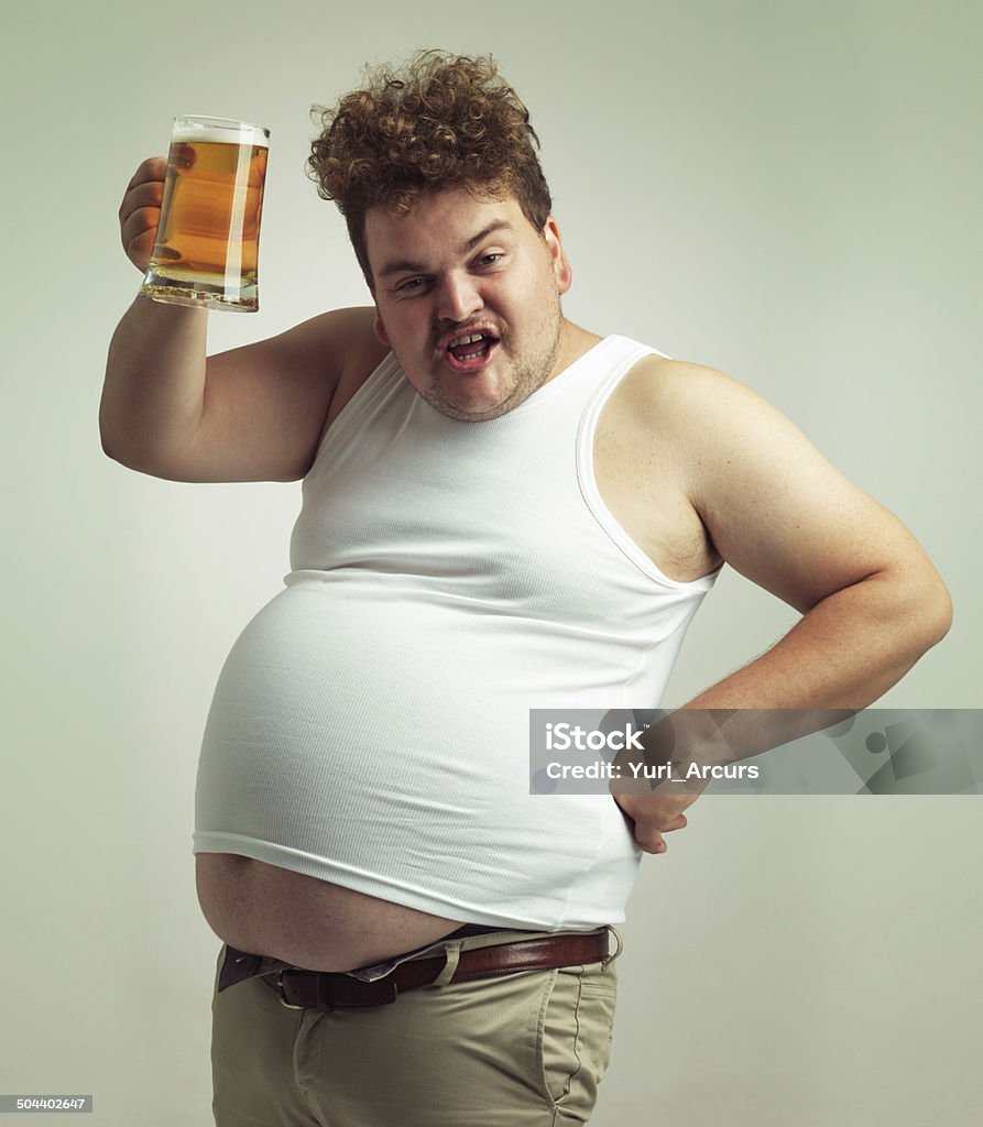 Cheers! Shot of an overweight man raising his beer in toast Men Stock Photo