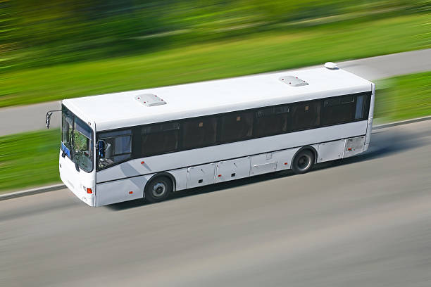 istock bus moving down the street 504403177