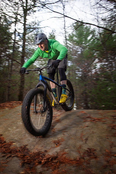 istock Man riding his fatbike on a trail. 504414550