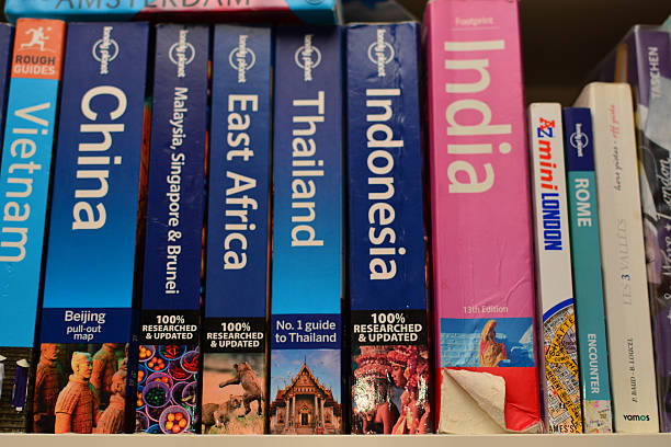 Asian women are picking up books on the bookshelf. To prepare to back to school