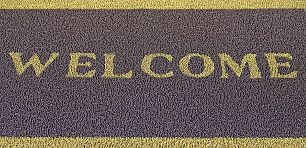 istock welcome text on brown doormat 504415860