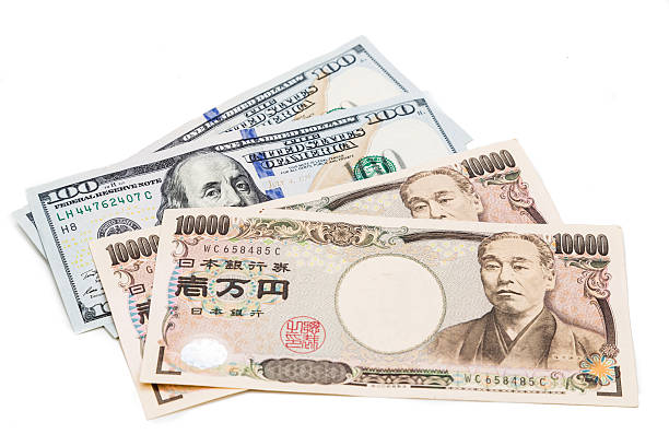 nahaufnahme der japanischen yen währung beachten sie, dass gegen us-dollar. - japanischer yenschein stock-fotos und bilder