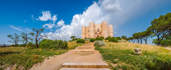 Apulia, Italy - June 30, 2014: Beautiful view of Castel del Monte, the famous castle built in an octagonal shape by the Holy Roman Emperor Frederick II in the 13th century in Apulia, southeast Italy