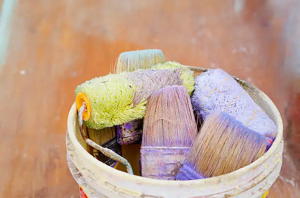 Paint bucket with used brushes
