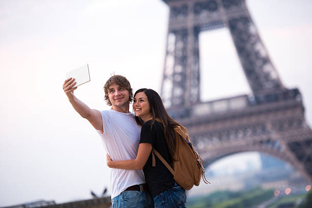 istock Couple taking selfie at the Eiffel Tower in Paris 504420122
