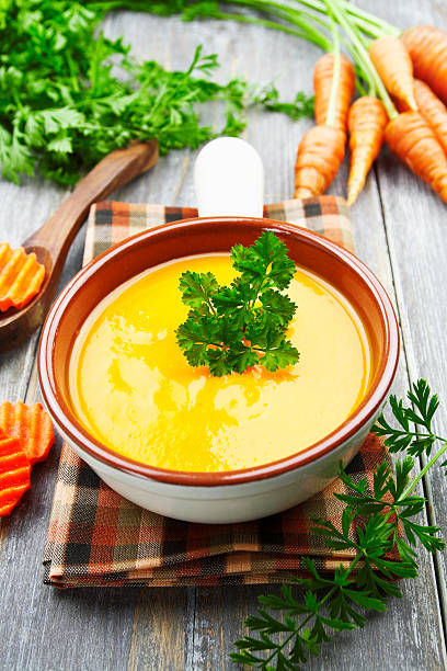 istock Carrots soup in the ceramic pot 504422080